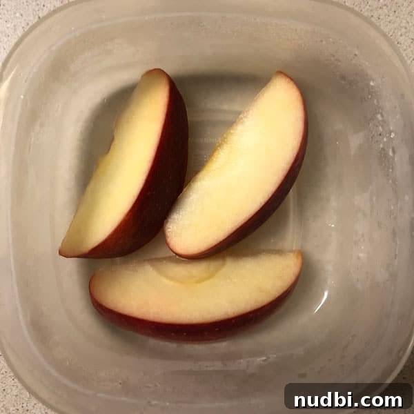 Unlock the Secret to Browning-Proof Apples 4 Sliced apples in lemon juice for freshness