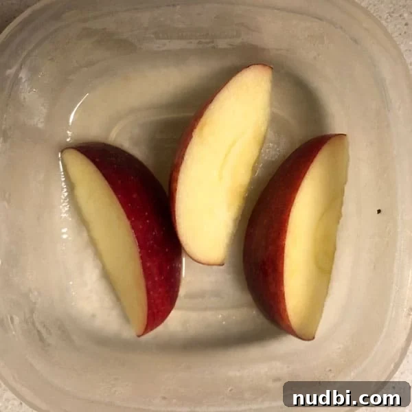 Unlock the Secret to Browning-Proof Apples 6 Sliced apples in pineapple juice for browning prevention