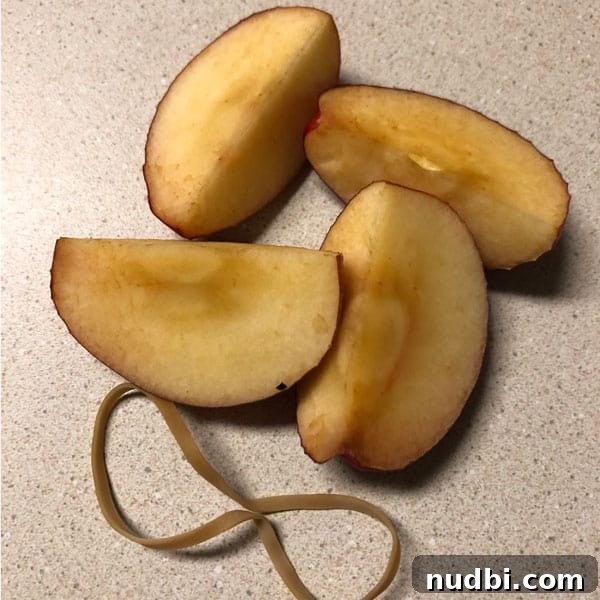 Unlock the Secret to Browning-Proof Apples 8 Sliced apples with rubber band to keep fresh