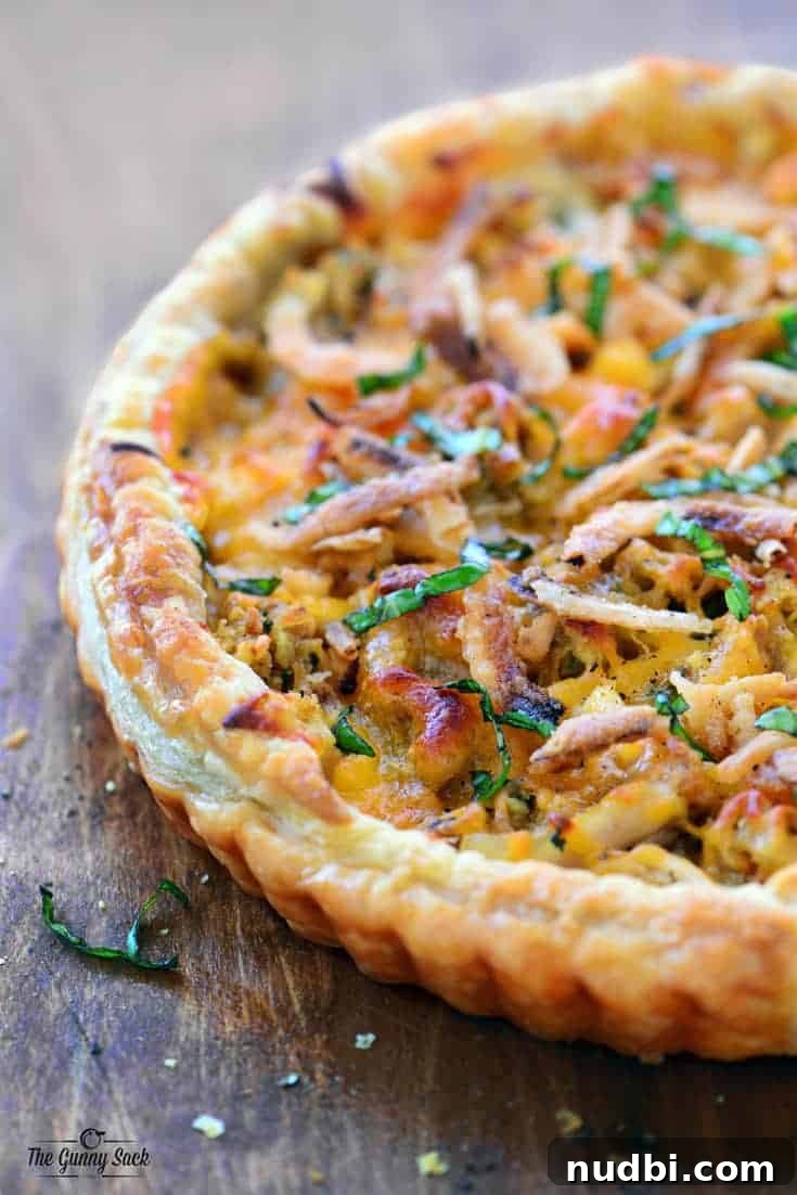 15 Delicious Ways to Reinvent Thanksgiving Leftovers 8 A gourmet Thanksgiving Pizza topped with holiday leftovers like turkey, stuffing, and cranberries.