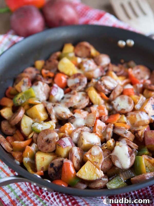 Cheesy Smoked Sausage and Red Potato Skillet