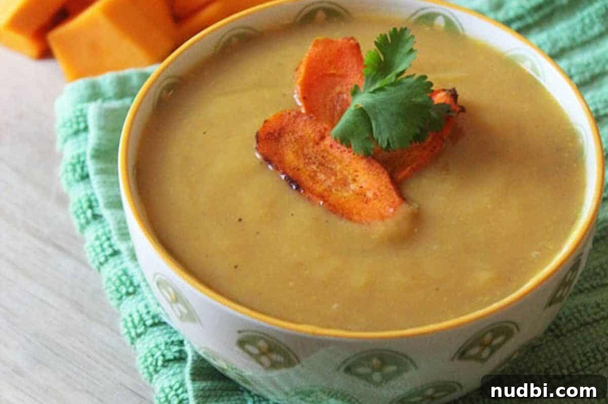 Kickstart Your Year with 28 Wholesome Recipes 5 Creamy Butternut Squash Soup served in a white bowl.