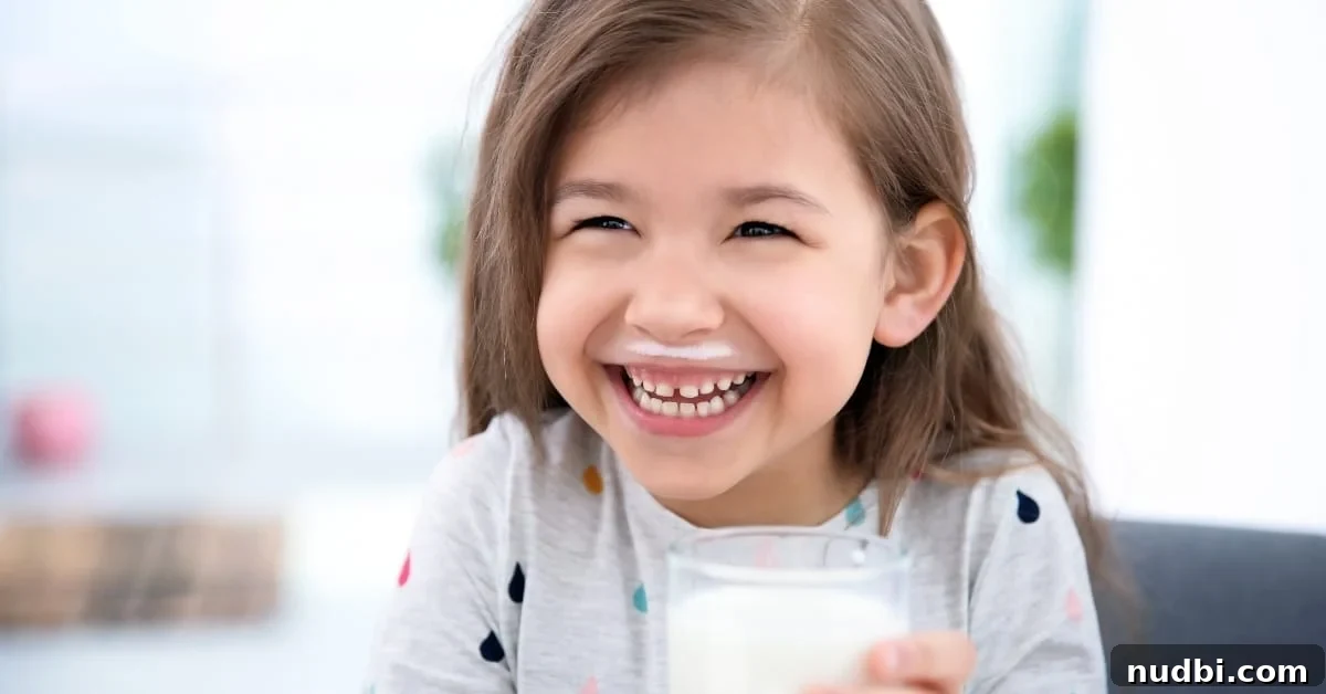 Do Kids Need More Protein? Essential Protein Guide for Kids Smiling child enjoying a healthy snack, illustrating the importance of protein for kids. Text overlaid asks 'Do Kids Need More Protein?'