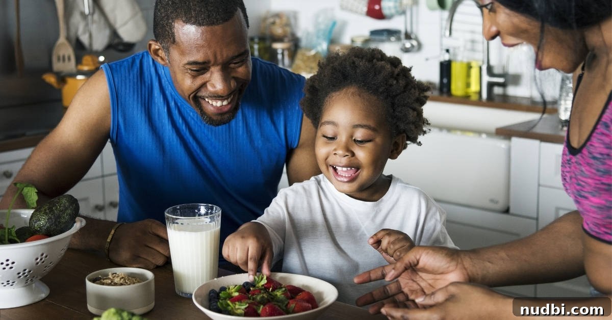 A family smiling and eating together, representing healthy New Year's resolutions for families.