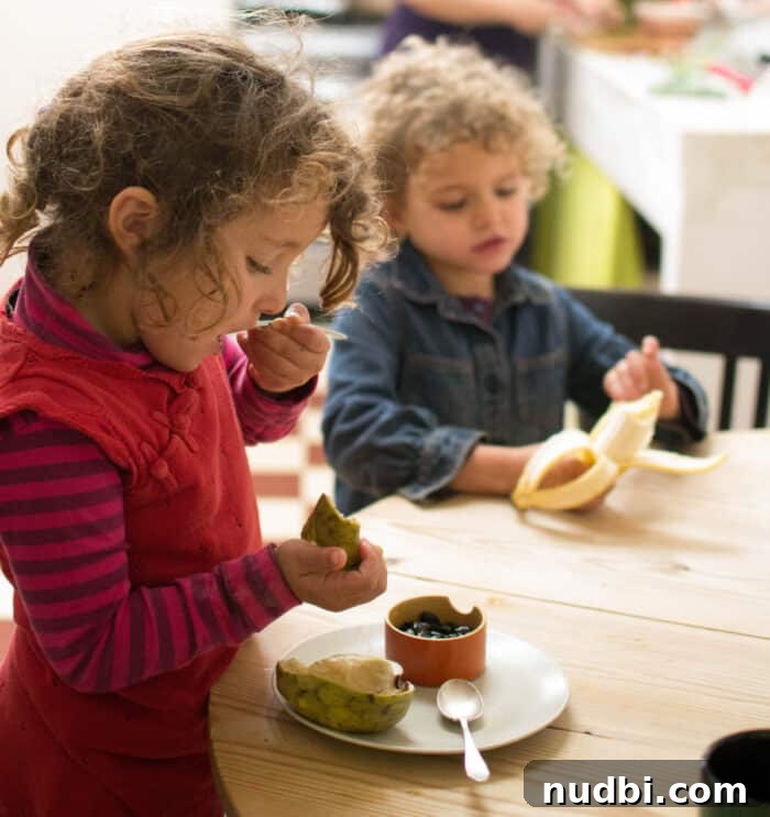 Children happily eating a meal, representing balanced nutrition or multivitamins for picky eaters.