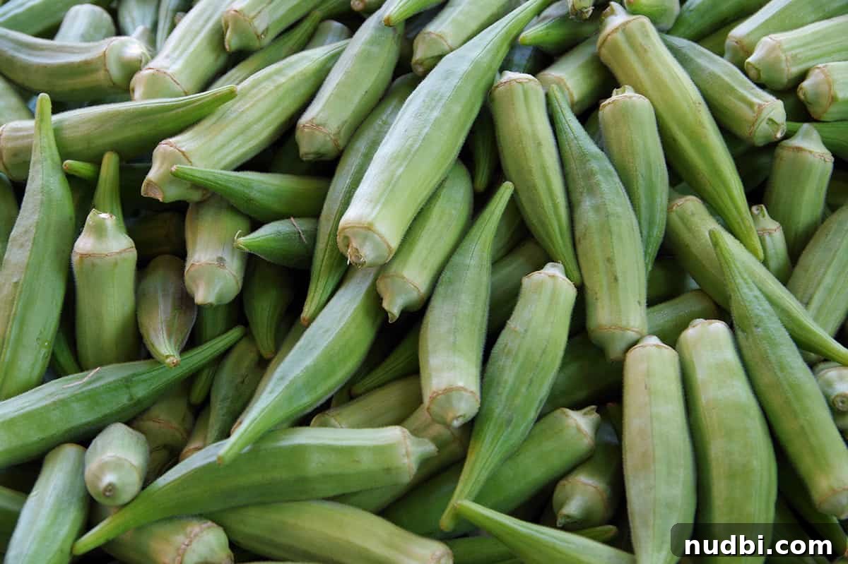 Fresh okra pods on a dark background