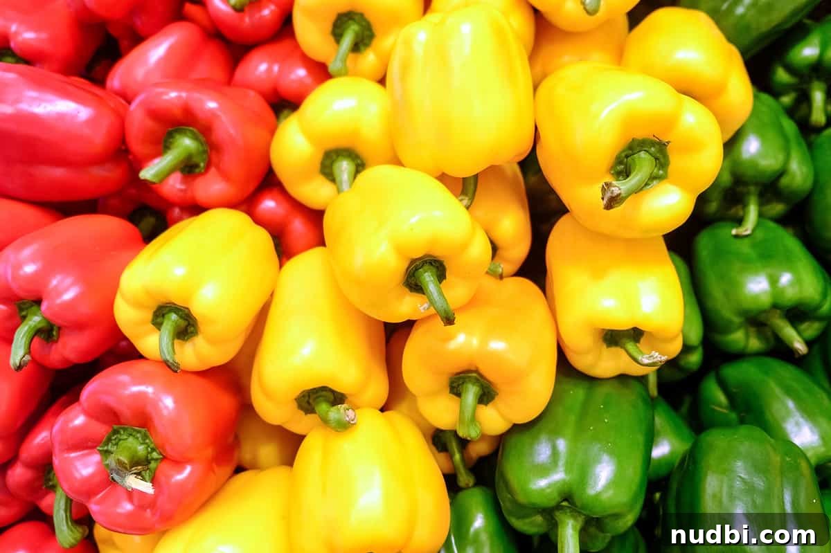 Assortment of yellow, red, and green bell peppers