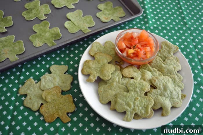 Shamrock-shaped spinach tortilla chips served with green avocado salsa