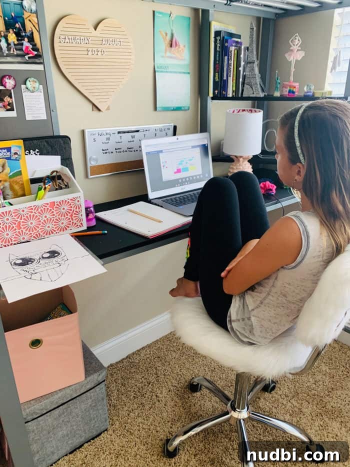 Making Remote Learning Work for Your Family 3 Girl sitting at desk with laptop open, engaged in virtual school