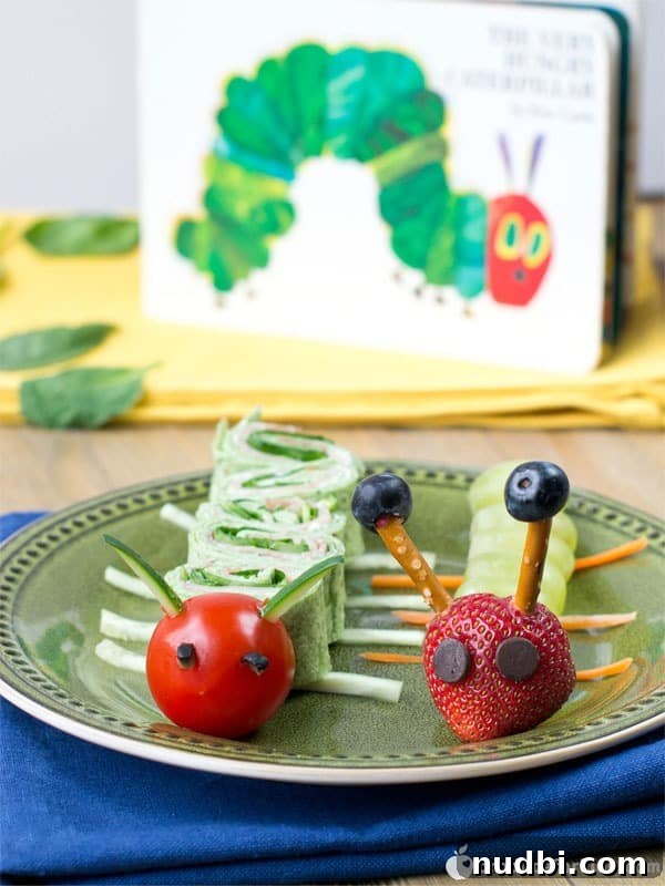 A vibrant green caterpillar made from stacked healthy food items, inspired by The Very Hungry Caterpillar book.