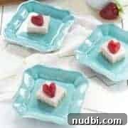 Small, bite-sized no-bake strawberry coconut cream treats.