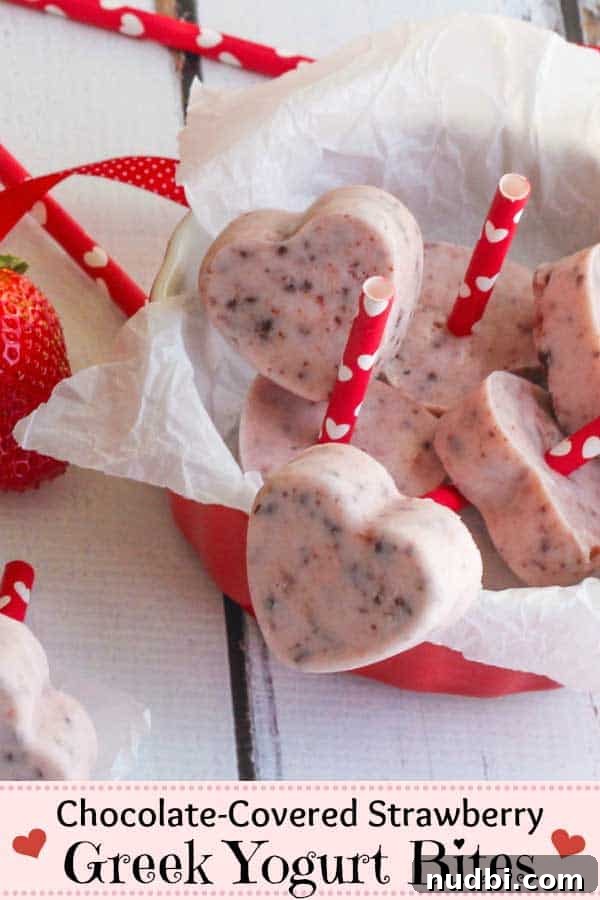 Frozen Greek yogurt bites resembling chocolate-covered strawberries.