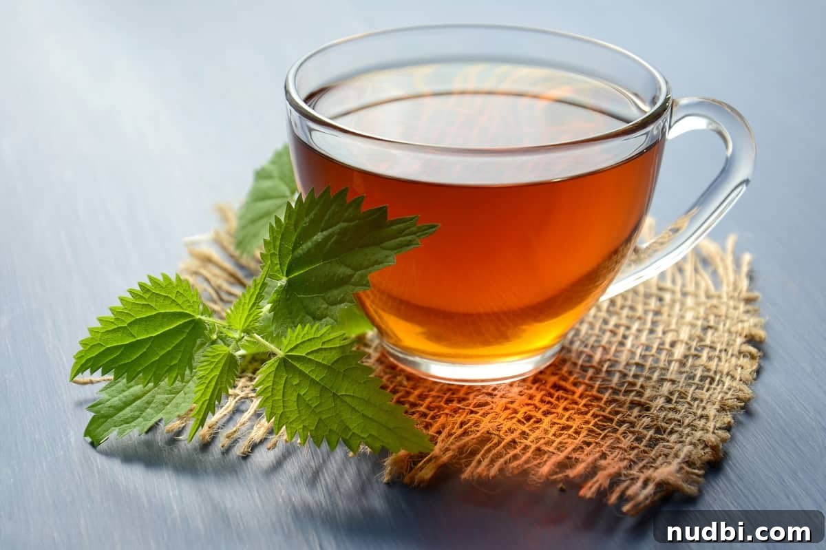 A steaming cup of chamomile tea with chamomile flowers, symbolizing relaxation and anxiety relief.