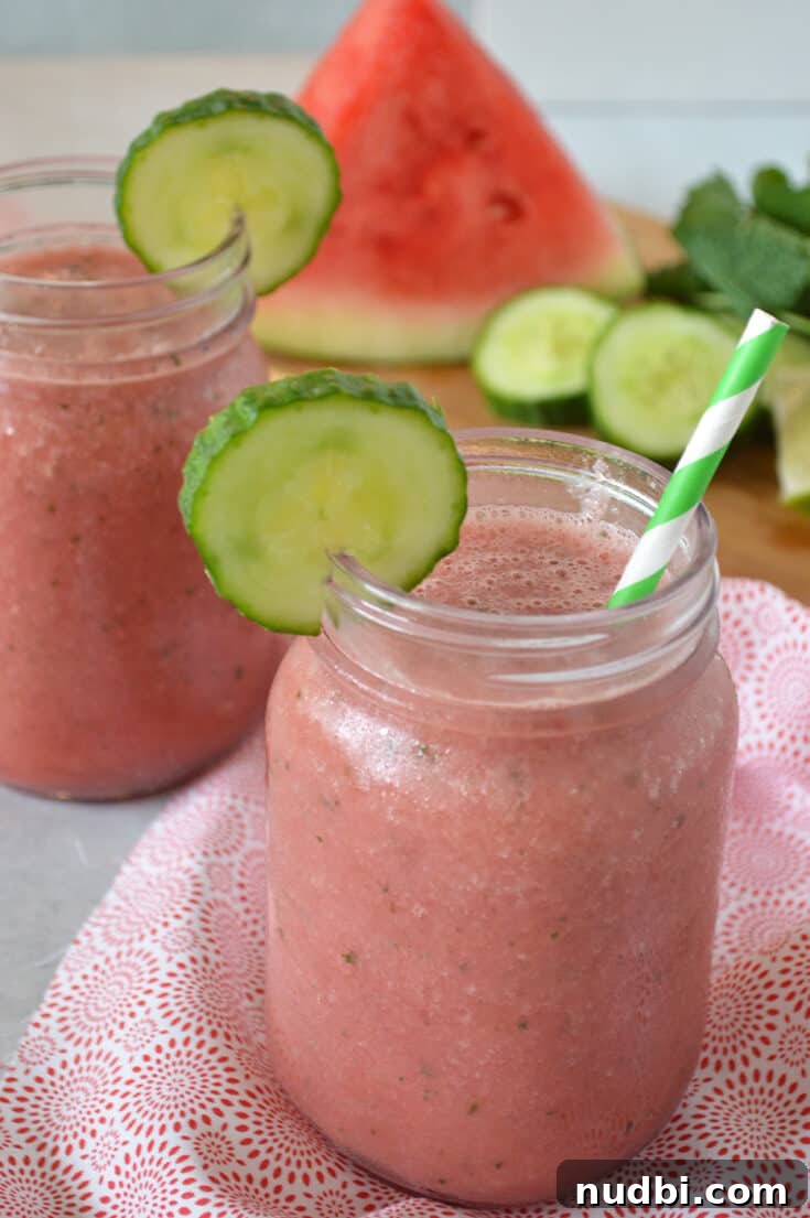 Refreshing watermelon cucumber smoothie with coconut water and mint, perfect for post-workout hydration.