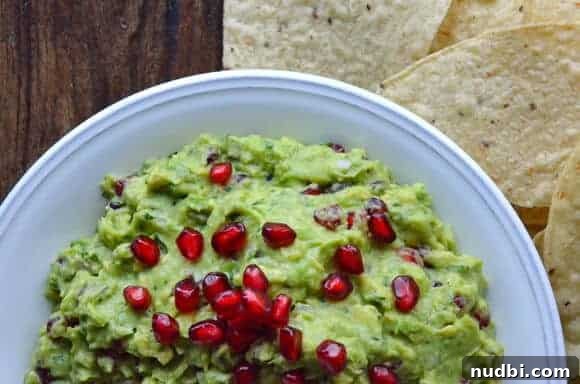 Pomegranate Guacamole with ruby red seeds
