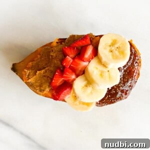A vibrant Banana PB and J Sweetpotato Breakfast Boat