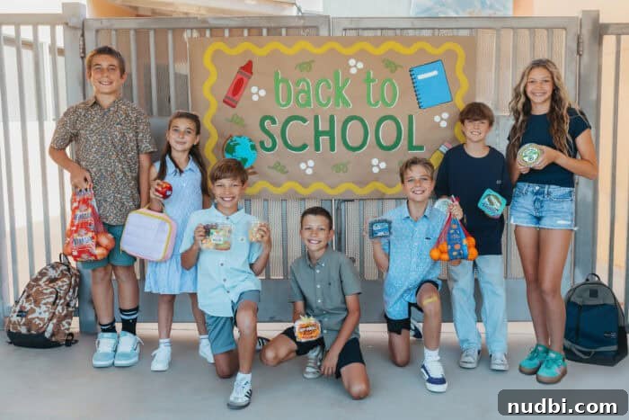 Smiling children with backpacks and school supplies, ready for a new school year