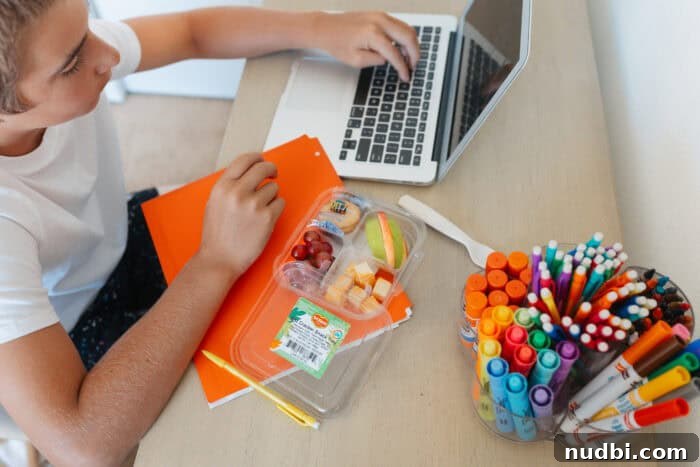 Del Monte fruit cups arranged with school supplies on a table, ready for healthy snacks