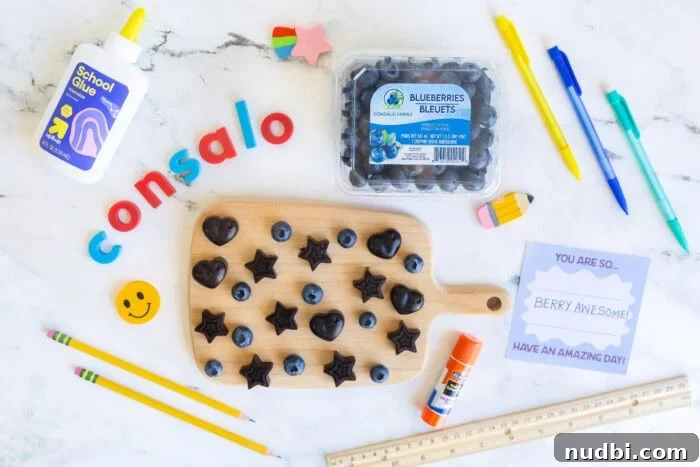 Back-to-school scene with Consalo Blueberries, homemade blueberry gummies, and colorful school supplies, highlighting healthy lunch options.