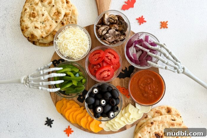 Wicked Treats and Spooky Eats 4 Flatbreads for cooking pizza and topping ingredients decorated with skeleton hands and Halloween decor