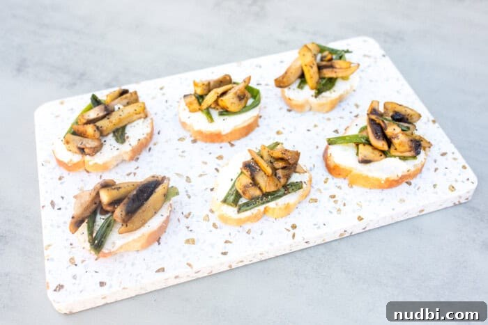 Holiday Crostini Bite-Sized Festivities 6 Mushroom and Ricotta Crostini on a serving board