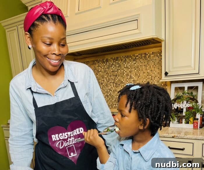A diverse family enjoying a healthy meal together, symbolizing balanced family wellness and new year resolutions.