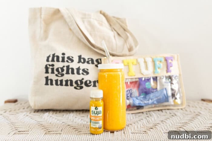 Suja Immunity Shot, turmeric and pineapple flavor, next to an orange juice drink, representing vitality.