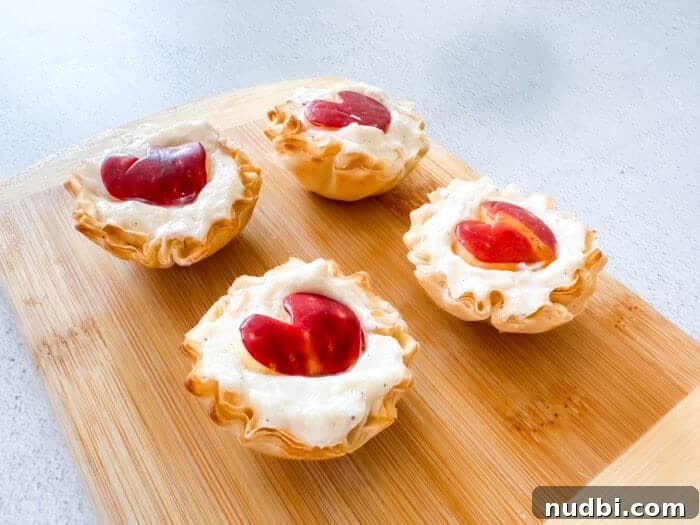 Healthy Valentine's Day Snack Board Ideas: 4 Delicious Apple Recipes 6 Greek yogurt apple heart phyllo dough cups on a serving board