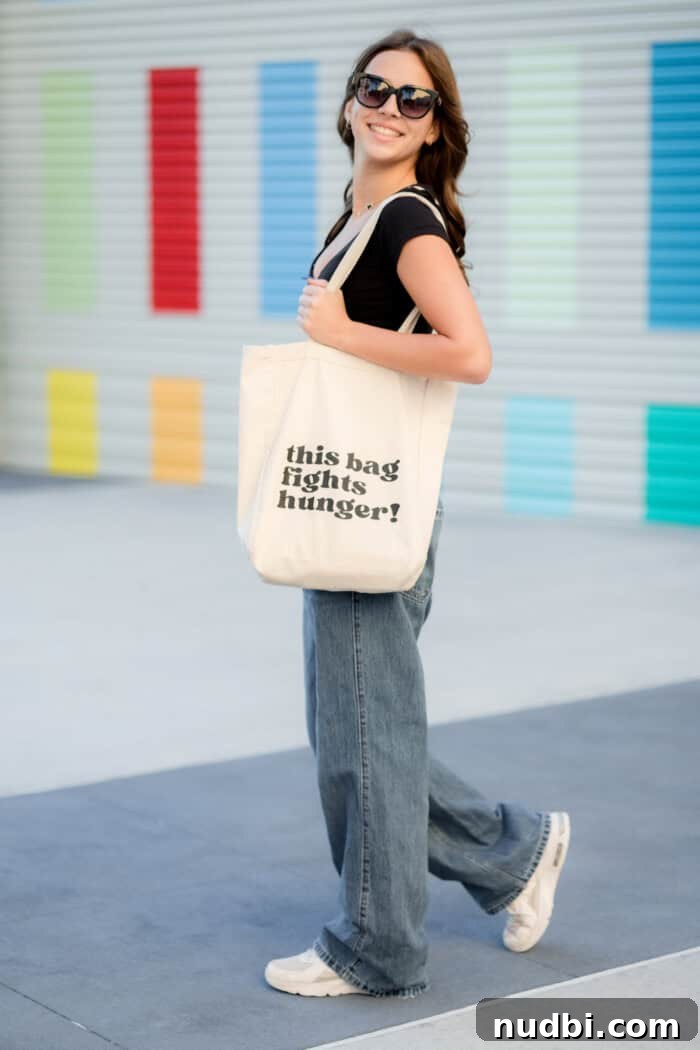 A 'Carry the Cause' tote bag filled with fresh produce, symbolizing nutrition and community support