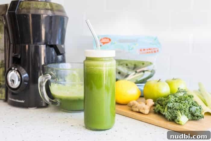 Freshly made green juice with mini cucumbers and pineapple