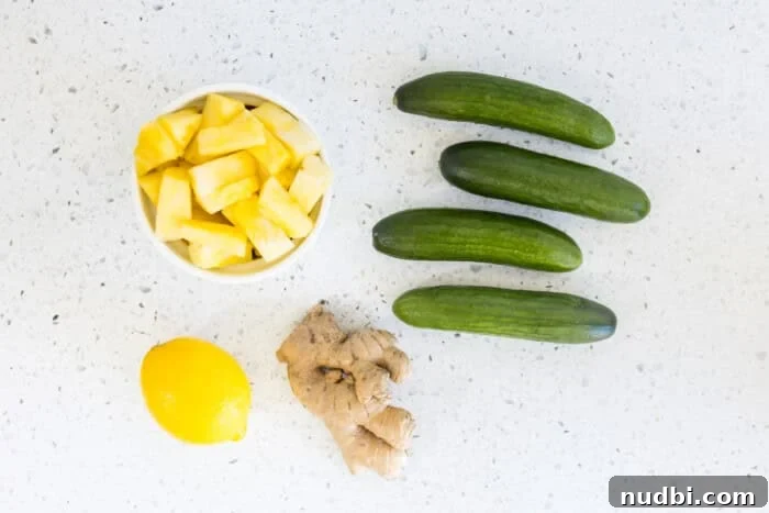 Chopped pineapple, mini cucumbers, lemon, and ginger for green juice