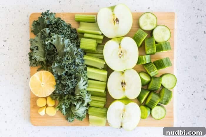 Chopped mini cucumbers, green apples, kale, lemon, celery, and ginger for anti-inflammatory green juice