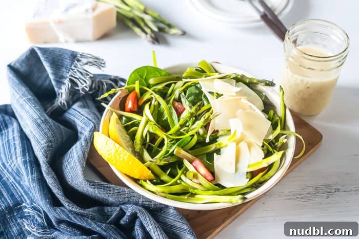 Vibrant shaved asparagus salad with parmesan and lemon dressing.