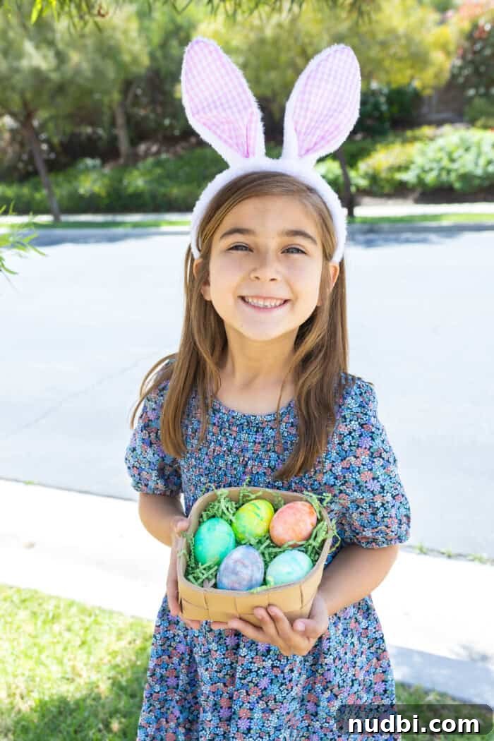 A basket full of beautifully dyed Easter eggs, showcasing various marbled patterns and vibrant colors created with Cool Whip.