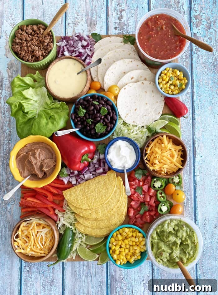 A beautifully arranged ultimate taco board, brimming with colorful and healthy toppings for a fun and interactive meal.