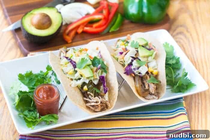 4 Epic Taco Creations for a Memorable Cinco de Mayo 2 A vibrant table laden with various tacos, fresh ingredients, and festive decorations, perfect for a Cinco de Mayo celebration.