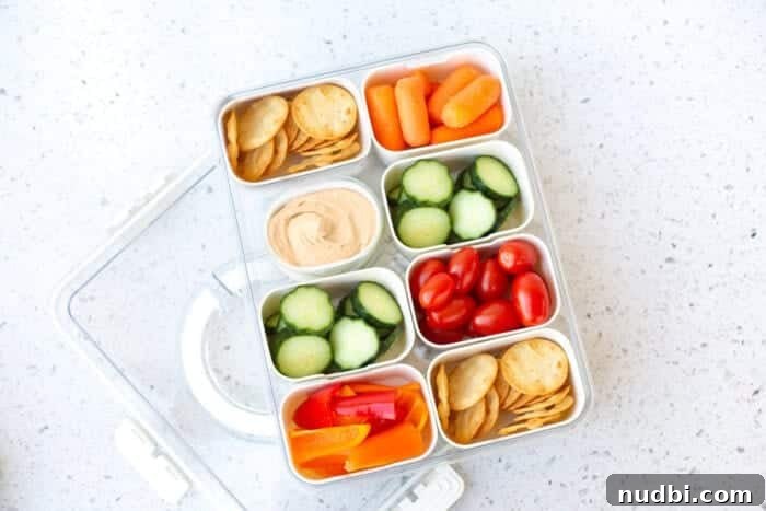 Excellent snack box with vegetables and hummus. A perfect snack choice.