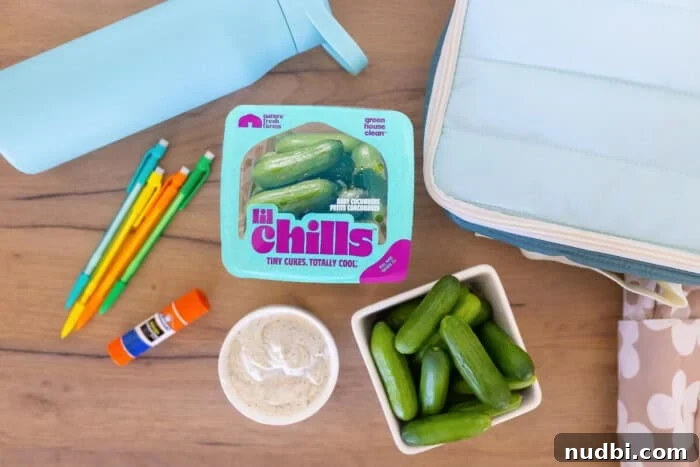 A serving of guacamole with Nature Fresh Farms Lil' Chills mini cucumbers for dipping.