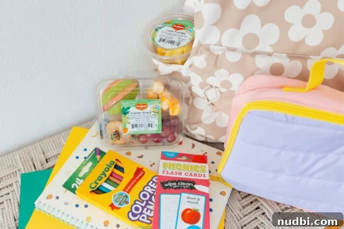 Smart Snacking: Fresh Fruit for Kids On The Go 4 Del Monte Grab and Go snack trays with fruit, cheese, and crackers, perfect for kids' lunches or after-school snacks.