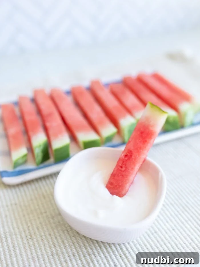 Long, slender watermelon sticks, ideal for quick, mess-free snacking.