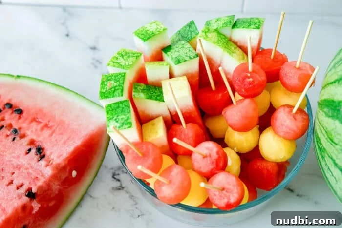 Watermelon balls, presented in a fun and elegant way for snacks or desserts.