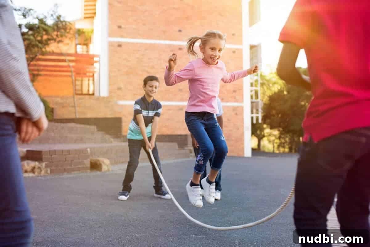 Happy elementary kids playing jump rope outdoors, celebrating Spring Break with joyful activities and laughter.