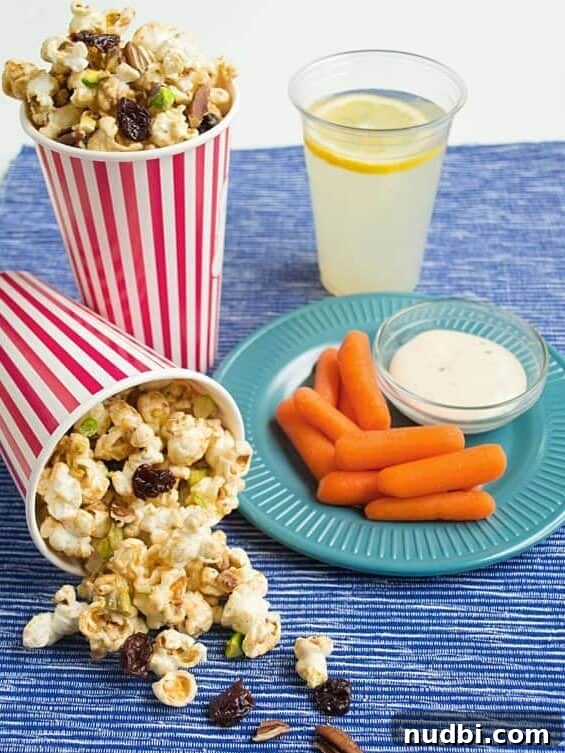 Delicious peanut butter drizzled popcorn, an ideal snack for an indoor puppet show activity.