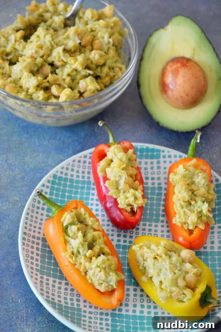 Smashed Chickpea Salad Stuffed Mini Sweet Peppers, vibrant mini peppers filled with a plant-based chickpea salad.