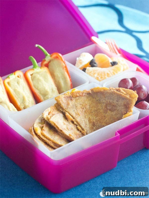 Southwest Quesadilla & Pepper Boats Bento Box, featuring colorful quesadillas and mini bell pepper boats.