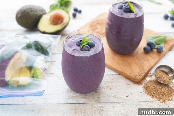 Elevate Your A.M. Plate 4 A vibrant blueberry avocado smoothie in a glass, showcasing a healthy and delicious breakfast option.