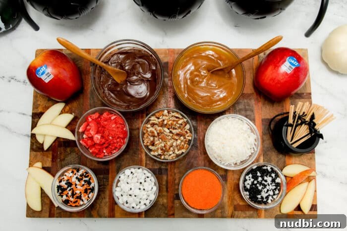Platter of Jazz™ apple slices with Halloween toppings like sprinkles, candy eyes, and caramel sauce, ready for decoration.