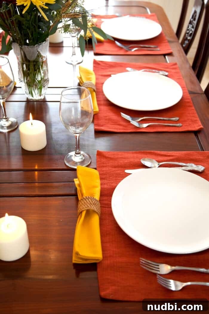 A beautifully set Thanksgiving table for three, ready for guests.