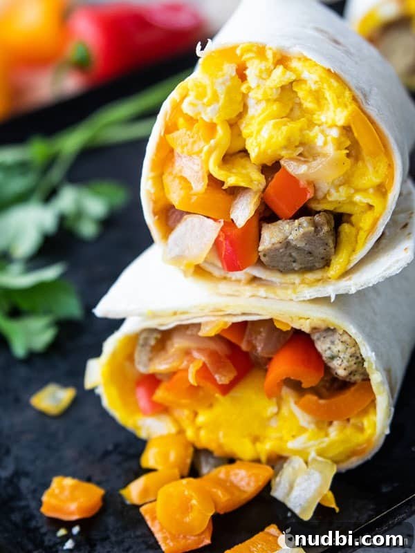 Hearty Veggie Breakfast Burritos with Turkey Sausage, wrapped in tortillas.