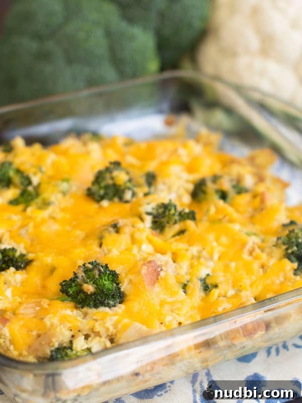 A hearty Cheesy Chicken & Broccoli Cauliflower Rice Casserole, baked to golden perfection.